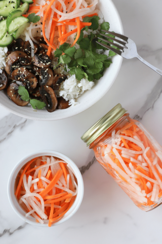 Pickled Daikon and Carrots in a jar and on top of a rice bowl